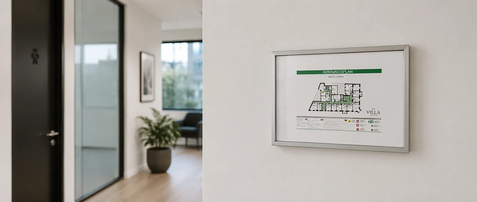 En utrymningsplan från Smart Signs på en vägg i en modern näringsfastighet